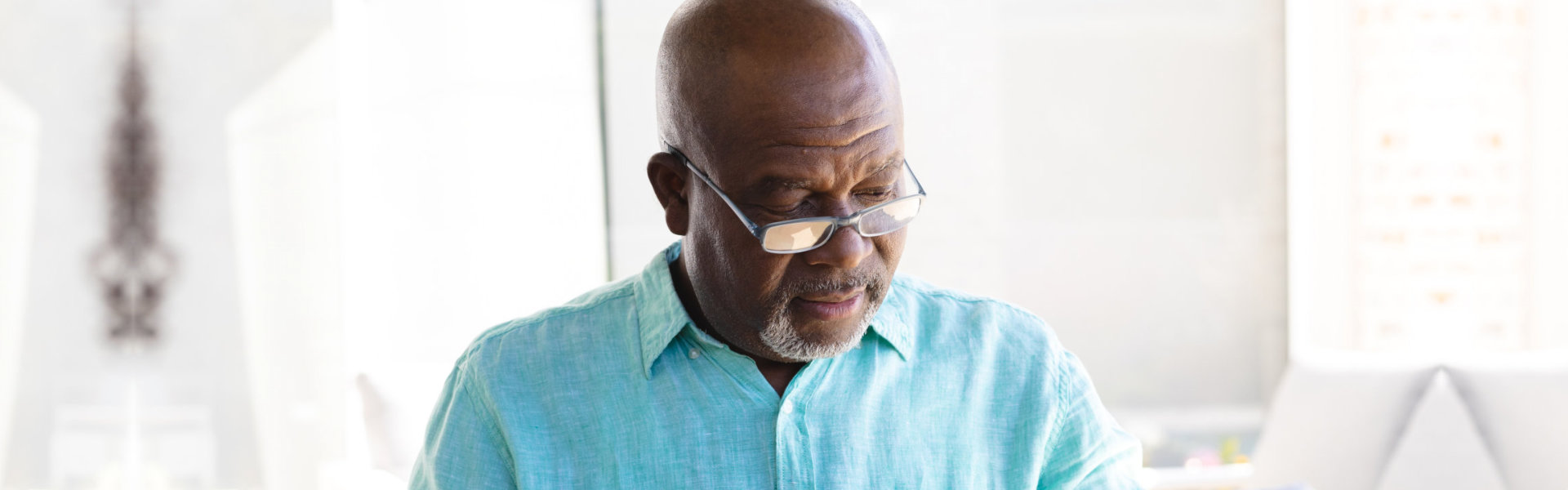 Elder man wearing blue polo